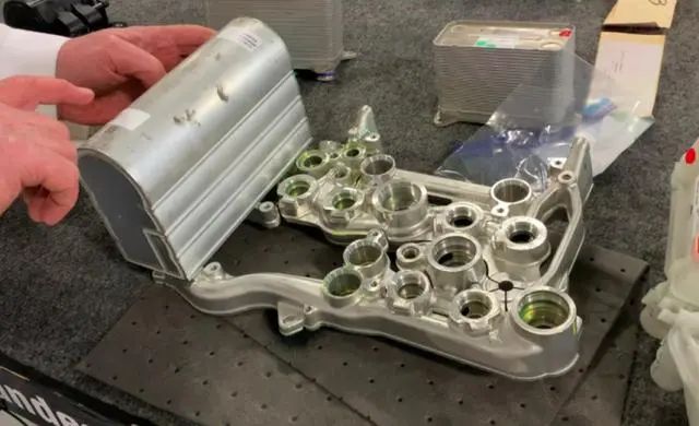 Refrigerant bracket with expansion relief slots