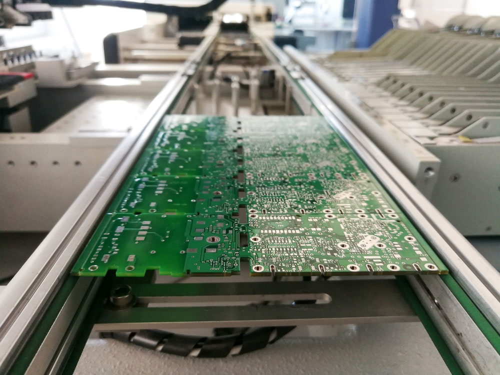 Automated SMT line placing components on multilayer prototype board