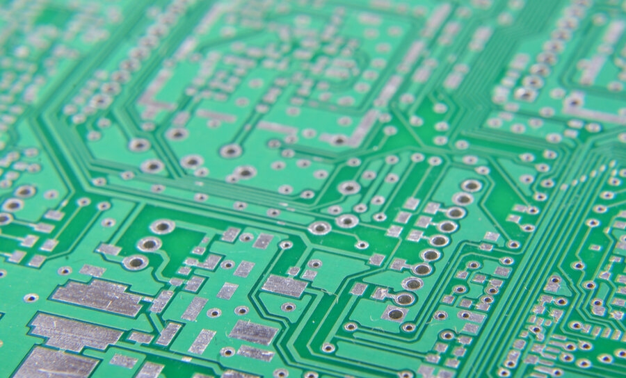 Microscope view of precise 0.3 mm vias milled by CNC for rugged sensor prototype