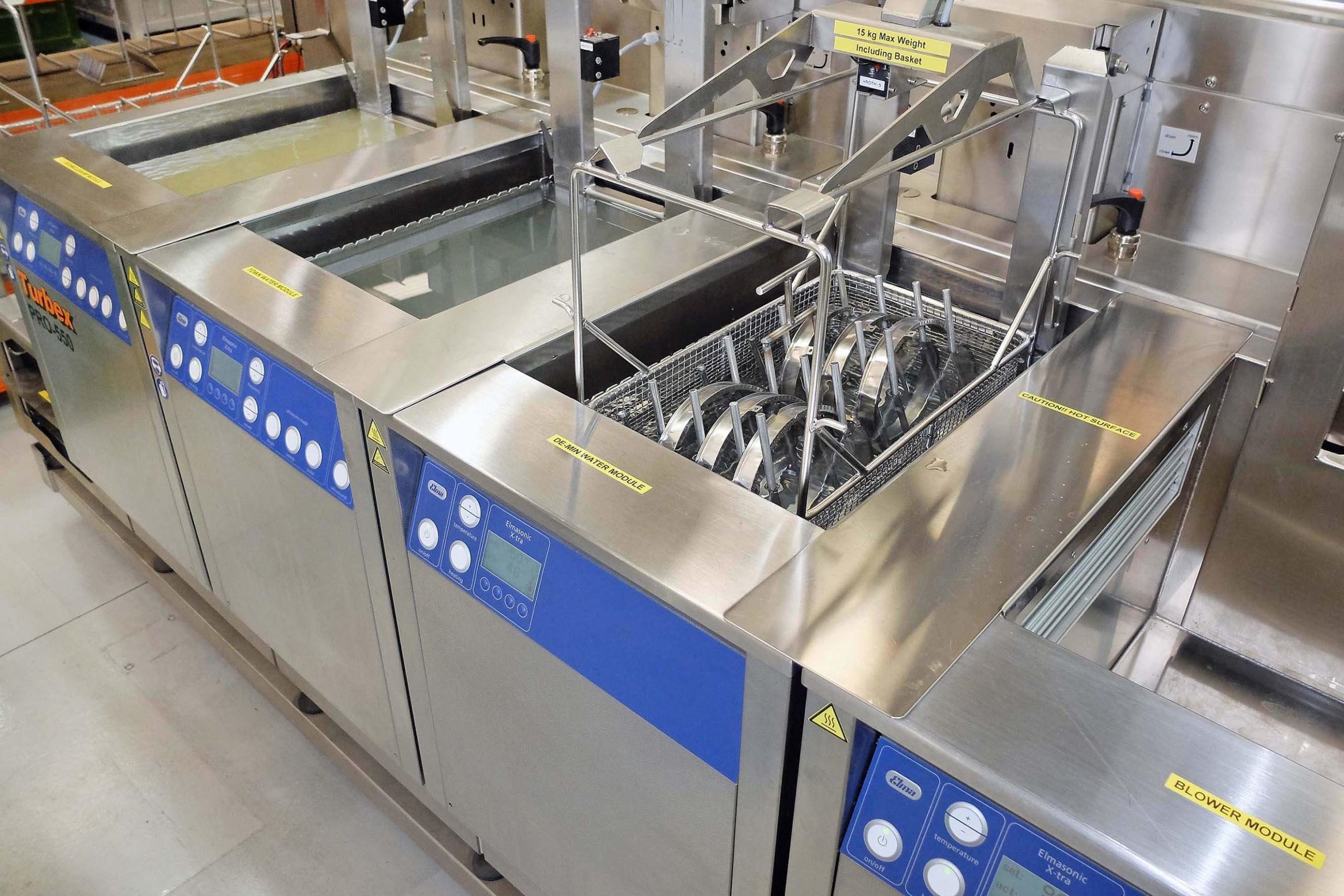Ultrasonic washer processing high-reliability boards for biocompatibility