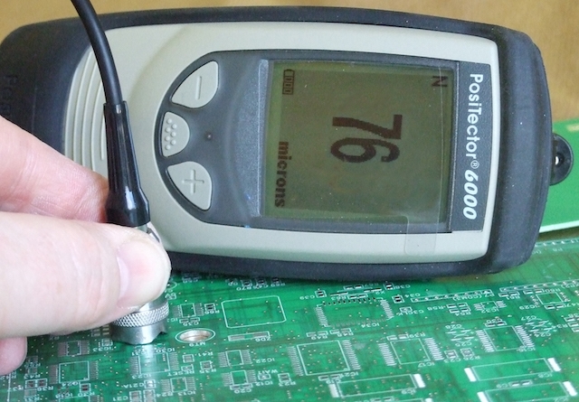 Using a micrometer to measure conformal coating thickness on a PCB