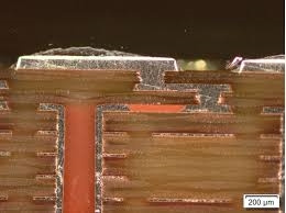 Close up view of microvias on an HDI PCB under a microscope