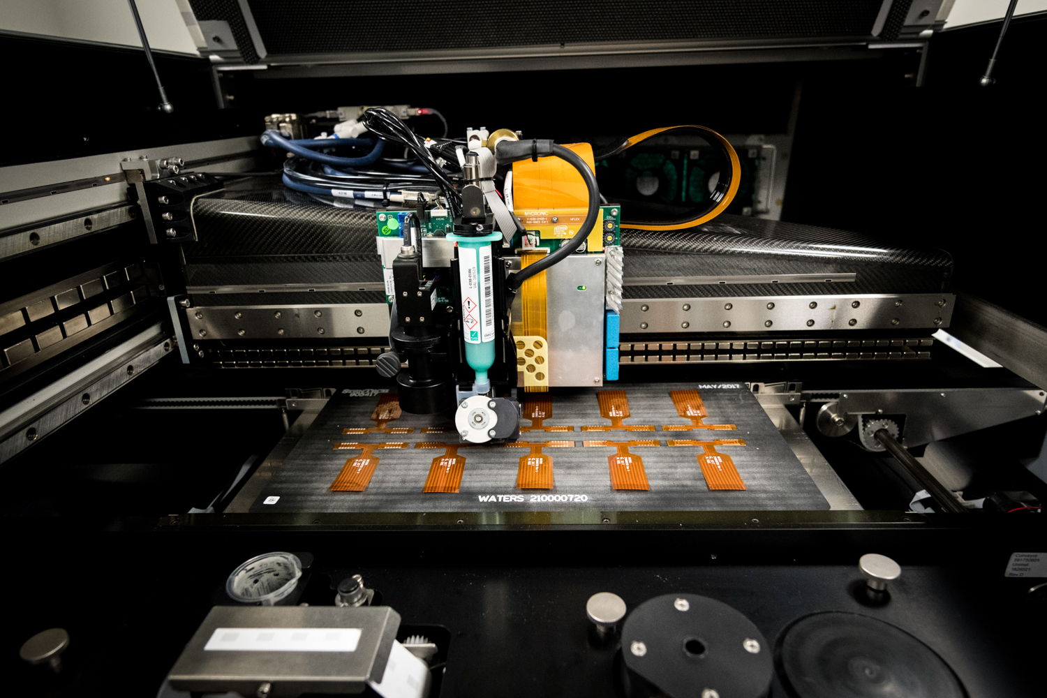 Custom fixture holding flex PCB flat during SMT component placement