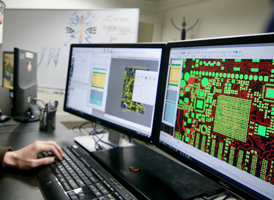 Engineer reviewing Gerber file output on a computer screen